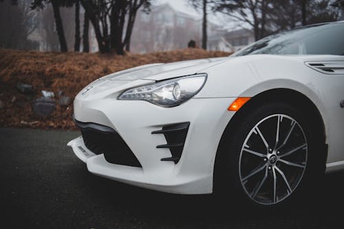 Contemporary white car parked on street