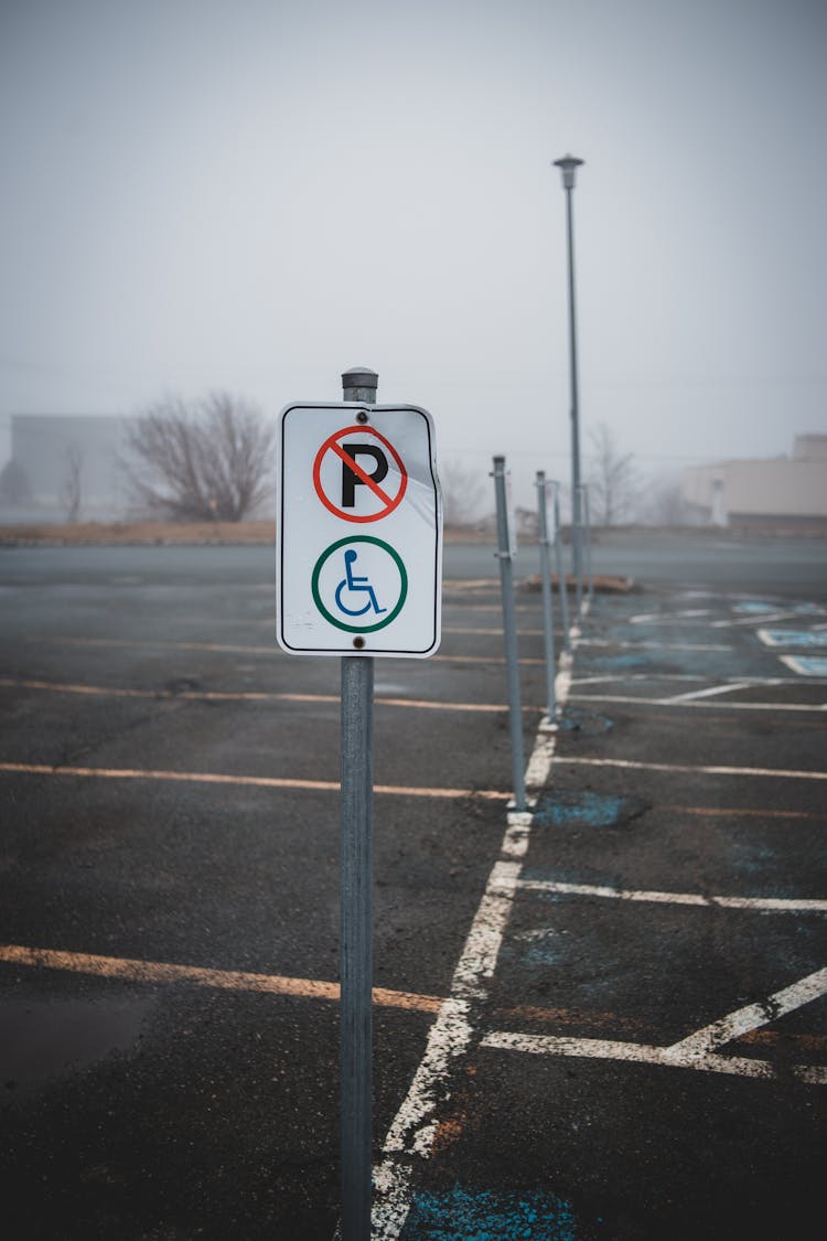 Disabled Parking Sign On Asphalt Path