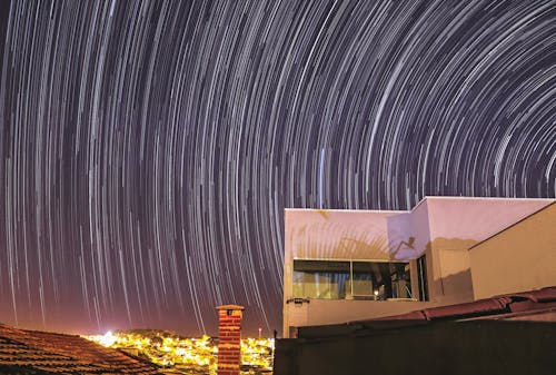 Free Stars on Night Sky Above House Stock Photo