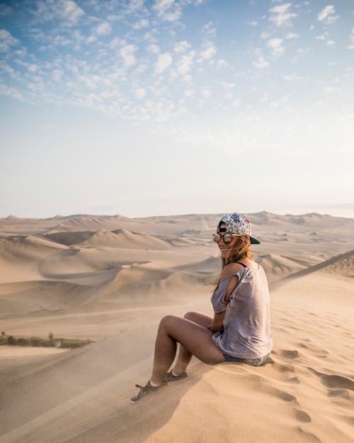 A Woman Sitting on the Desert