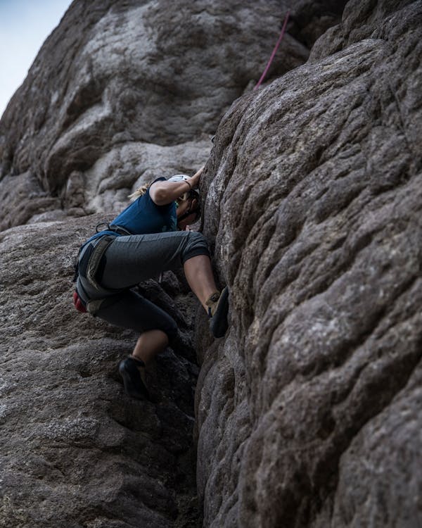Free A Woman Rock Climbing Stock Photo