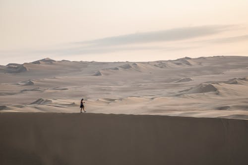 A Person Walking on the Desert