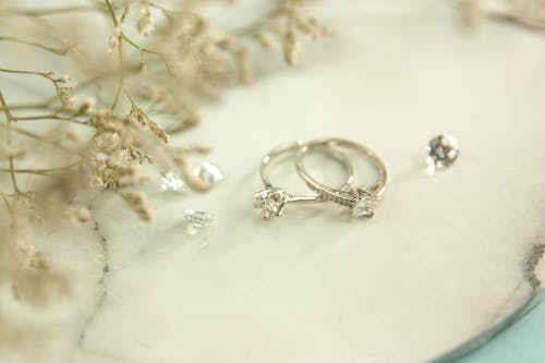 Free Engagement rings placed near twigs Stock Photo