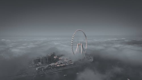 Free Grayscale Photo of Ain Dubai Surrounded With Clouds Stock Photo