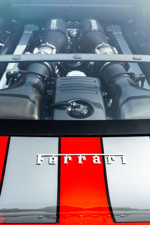 Free High-angle close-up shot of a Ferrari engine in a luxury car, showcasing power and engineering. Stock Photo