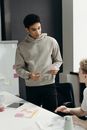 Man in Gray Sweater Standing Beside a Man