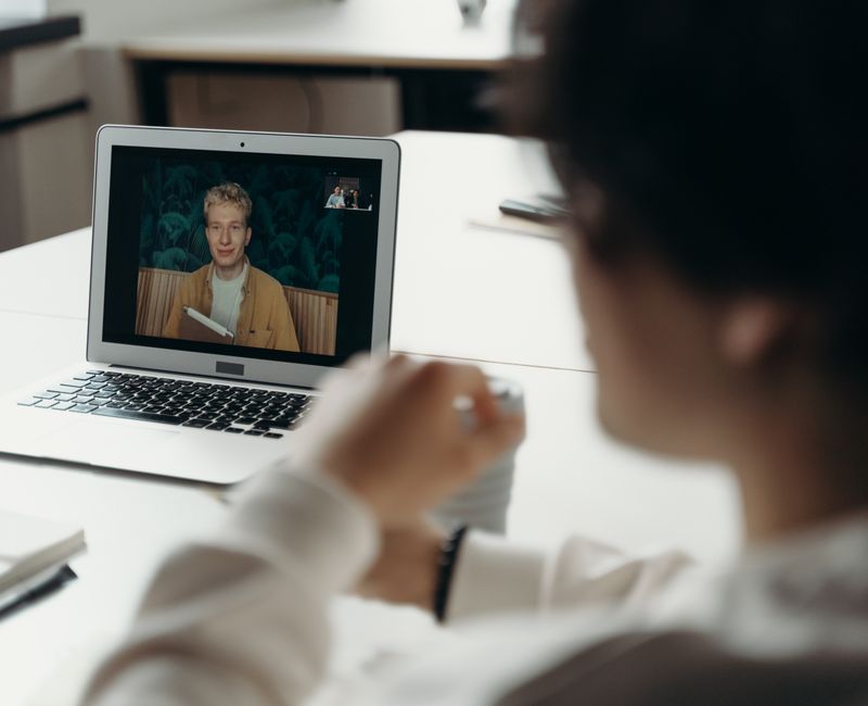 A virtual support group meeting on a video conferencing platform