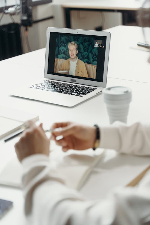 Man on a Laptop Screen During a Meeting