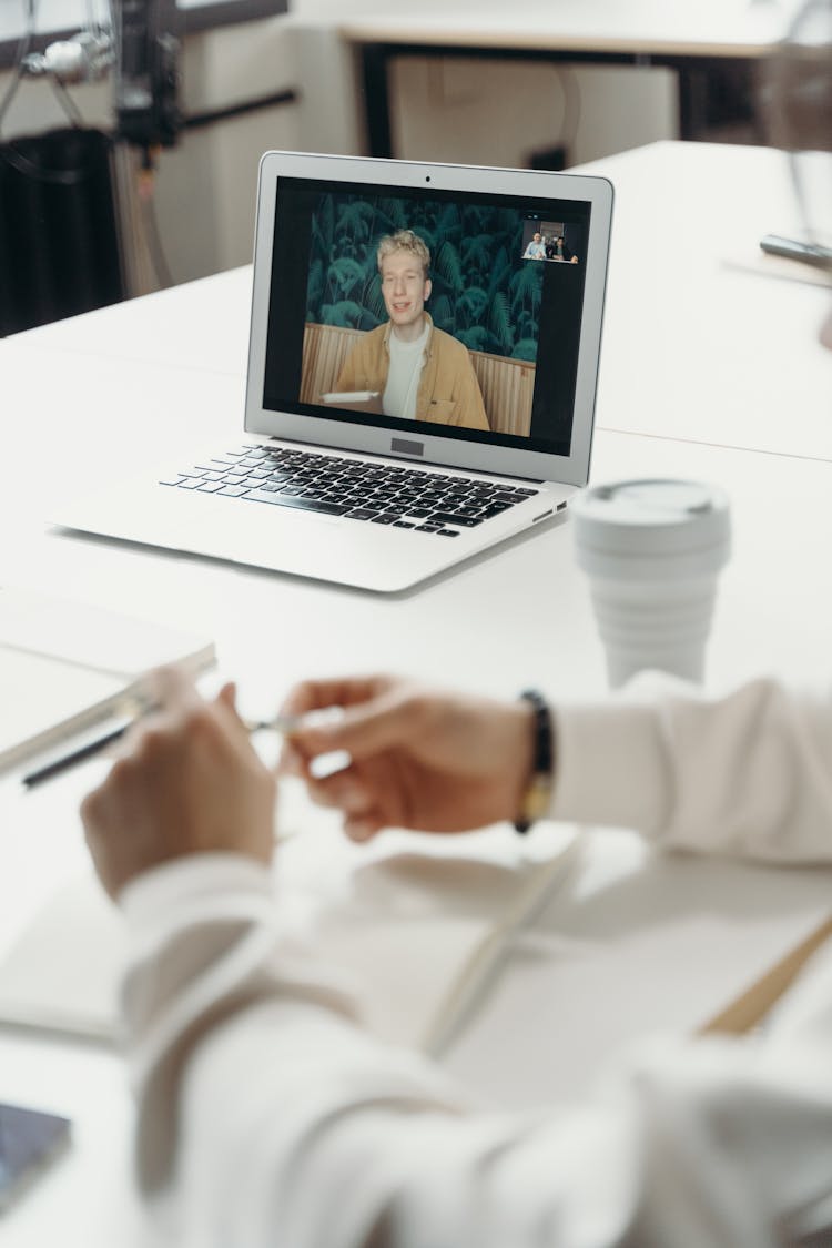 Man On A Laptop Screen During A Meeting