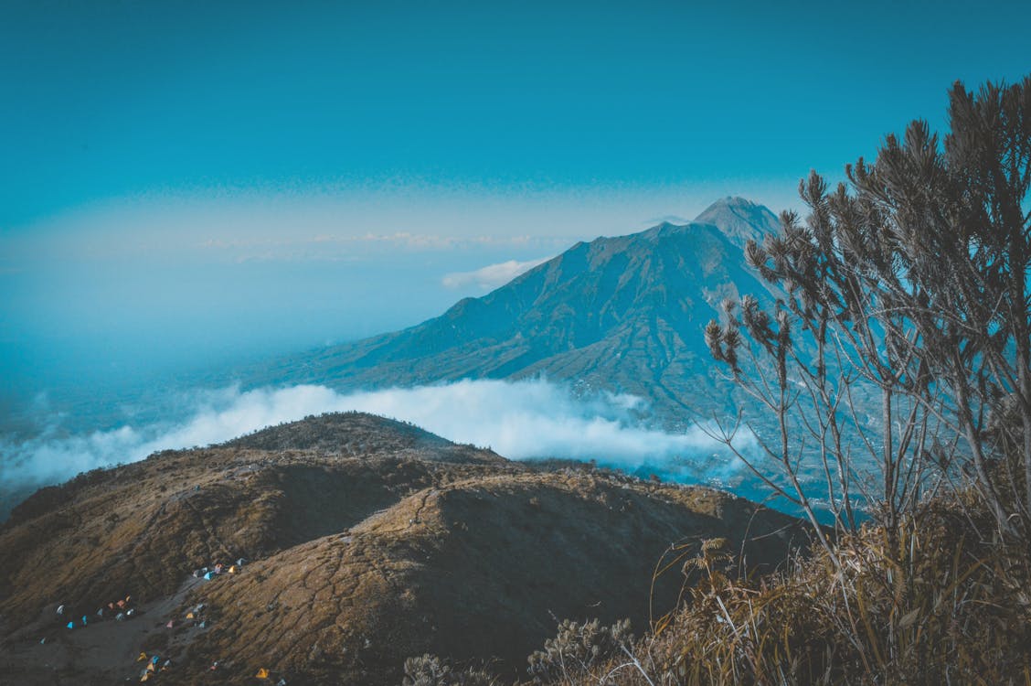 Landscape Photography of Mountain Surrounded by Sea of Clouds