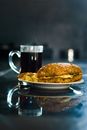 Close-Up Shot of a Cup of Coffee beside a Bread