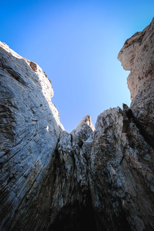 Rough rocks on sunny cloudless day