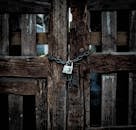 Close-Up Photo of Locked Wooden Doors