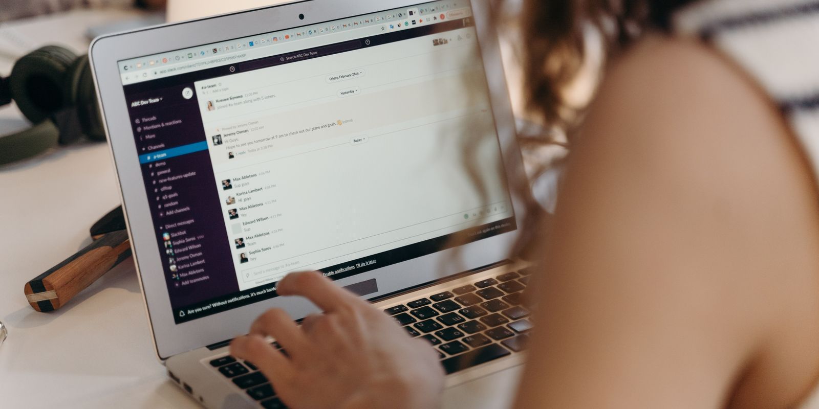 A laptop screen showing an email inbox being sorted and cleaned up