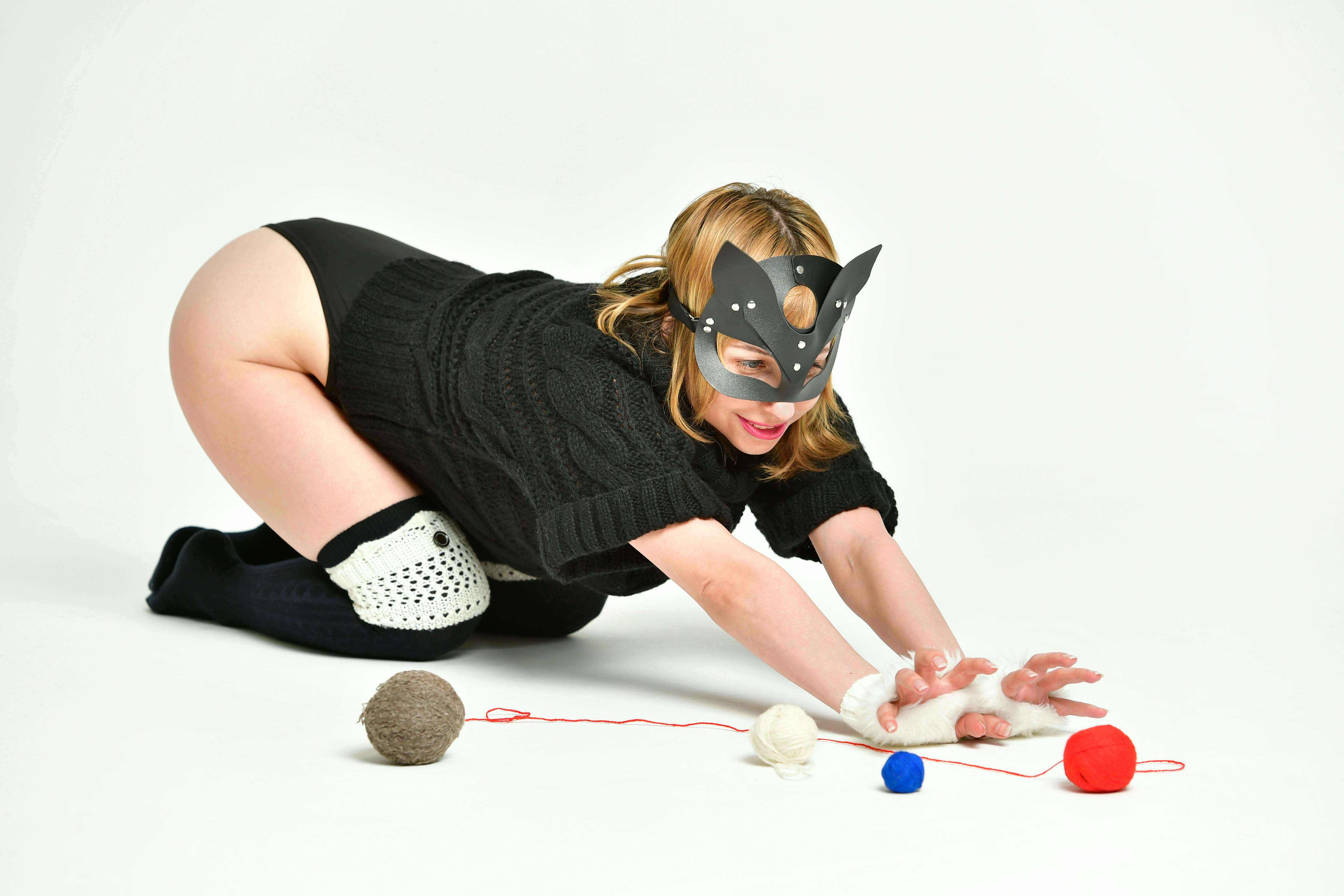 sexual woman in cat mask with threads