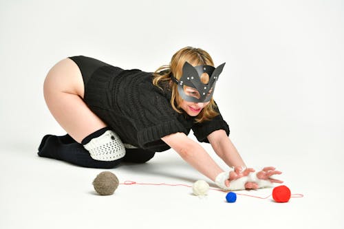 Sexual woman in cat mask with threads