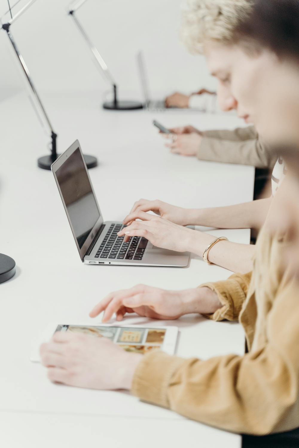 People Using a Laptop and a Tablet · Free Stock Photo