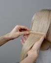 Woman in White Shirt Covering Her Face With Her Hair