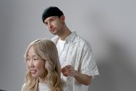 Man in White Button Up Shirt Beside Woman in White Button Up Shirt