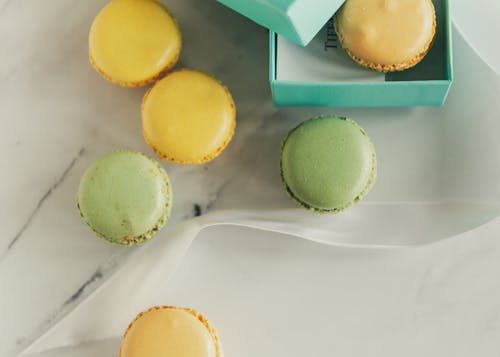 Close-Up Shot of Macarons on a White Surface