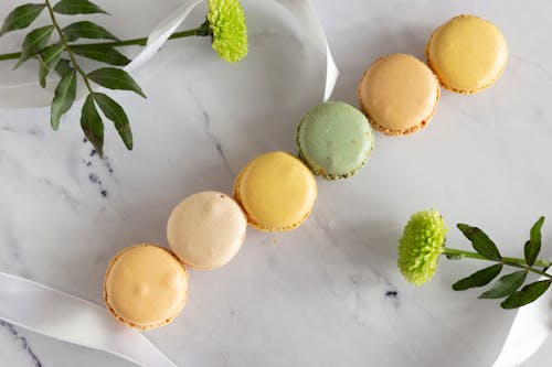 Close-Up Shot of Macarons on a White Surface