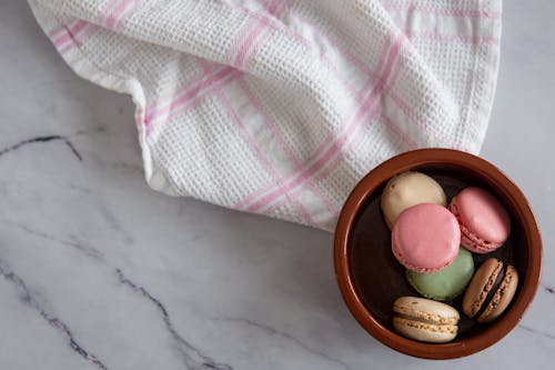 Overhead Shot of Macaroons in a Brown Bowl