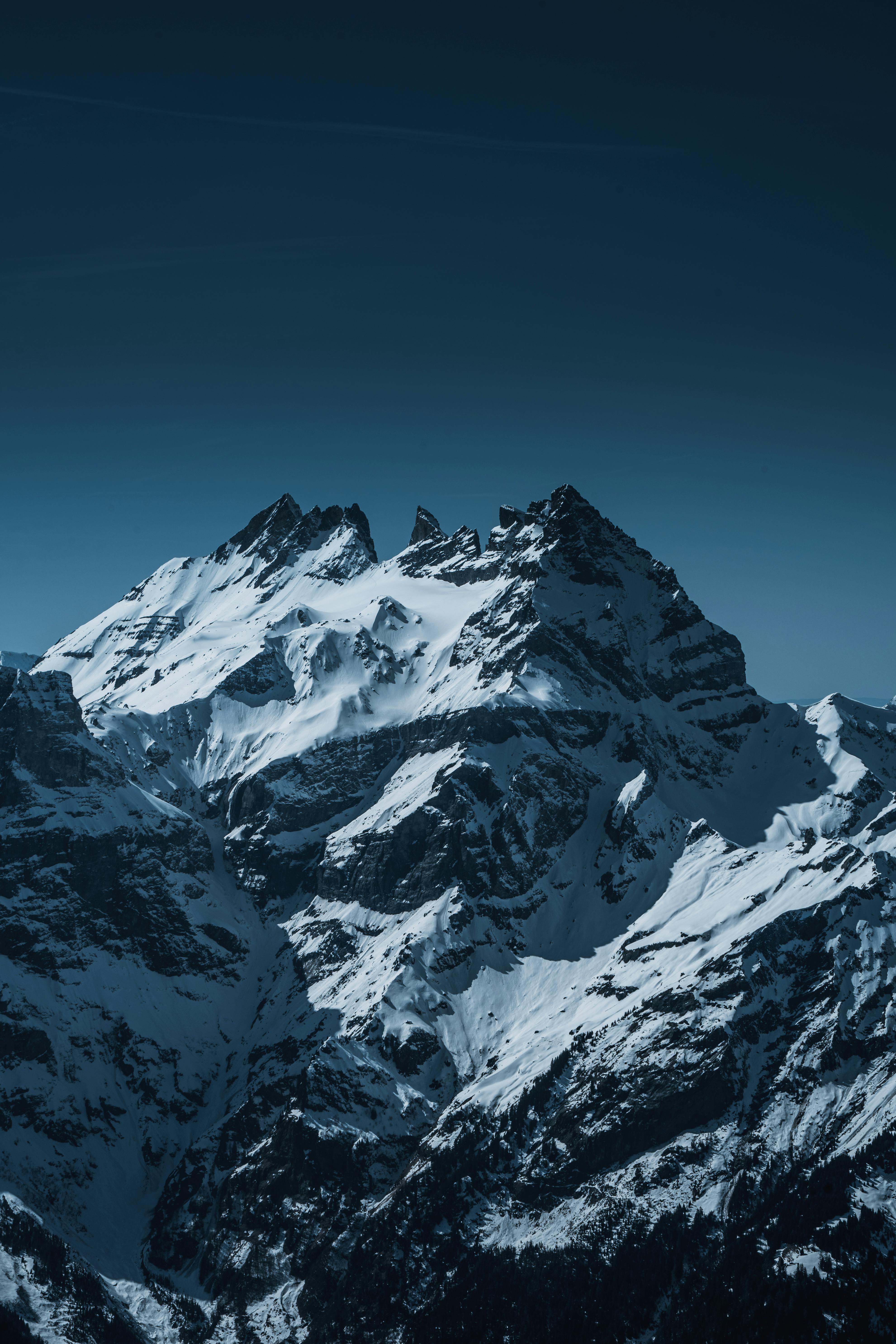 Breathtaking winter scene of snow-covered mountains in Val-d'Illiez, perfect for nature lovers.
