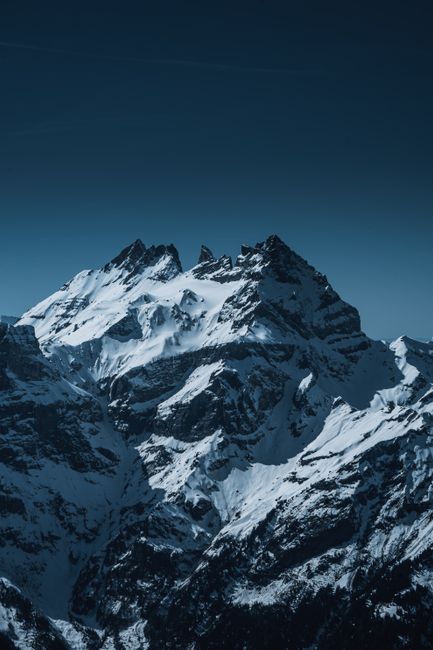 Breathtaking winter scene of snow-covered mountains in Val-d'Illiez, perfect for nature lovers.