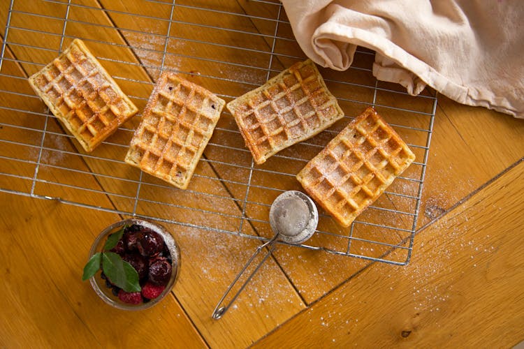 Overhead Shot Of Waffles With Powdered Sugar