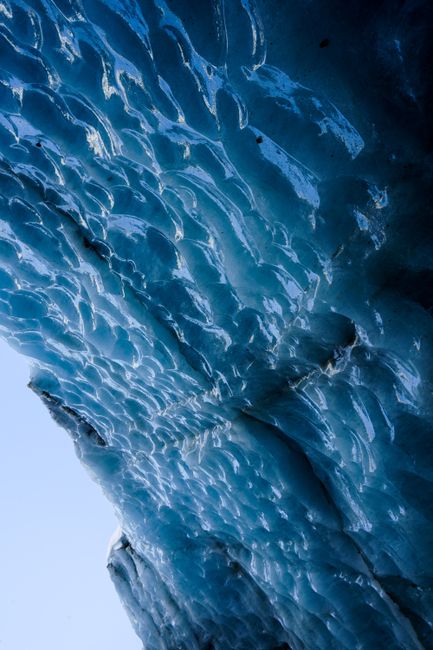 Detailed close-up of a frozen iceberg showcasing natural texture and intricate ice patterns.
