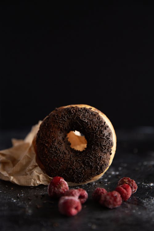 Free Chocolate Donut Near Red Raspberries Stock Photo