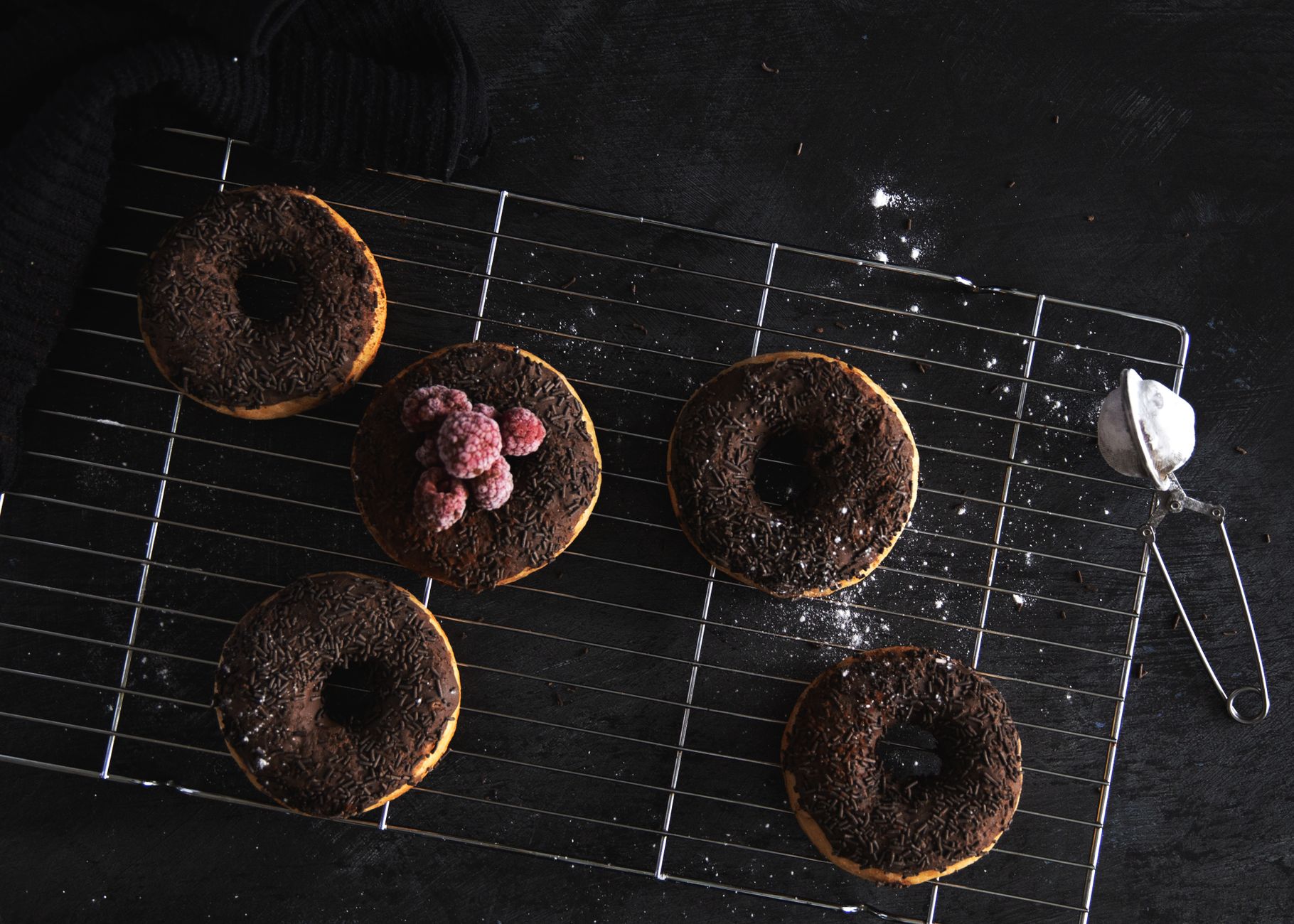 Fresh homemade soft donuts cooling on rack