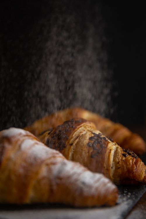 Free Close-up of sprinkled croissants showcasing their flaky texture and appetizing look. Stock Photo