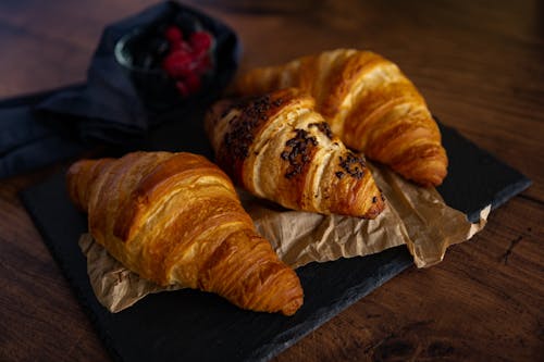 Free Three Croissants on Craft Paper Stock Photo