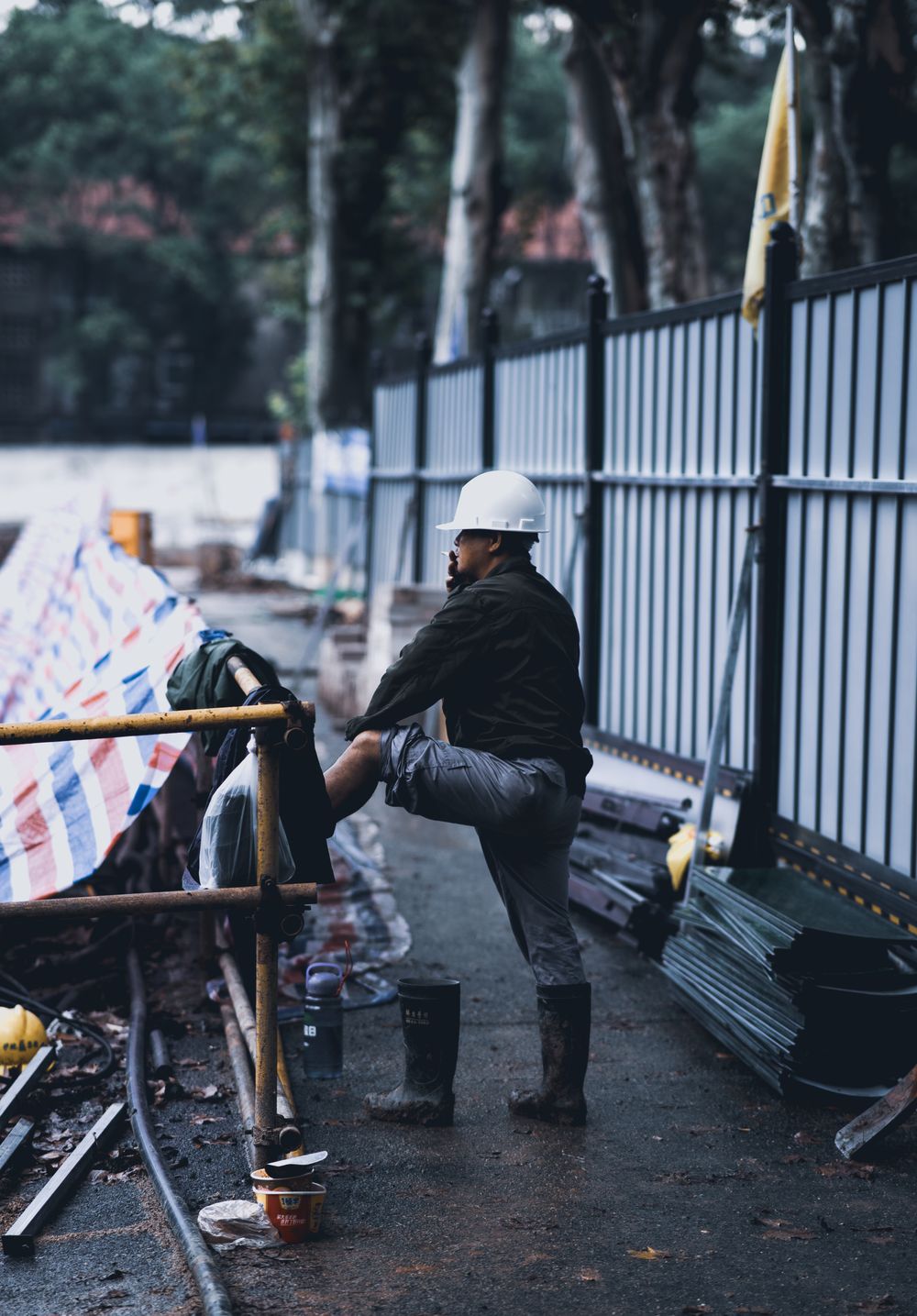 Ironbark roofer on site in wet weather gear