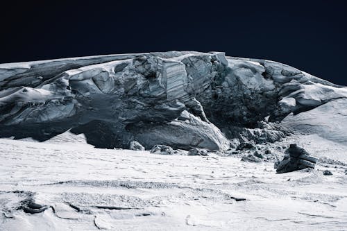 A Gray Rock Formation Under Dark Sky