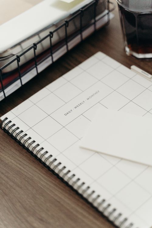 Planner, coffee and tablet ready for a weekly review