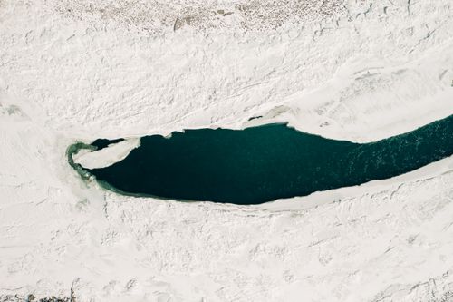 Free Stunning aerial shot of a frozen lake in winter, Ongudaysky District, Russia. Stock Photo