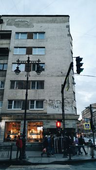 A bustling street scene showcasing urban life in Sankt-Peterburg, Russia with pedestrians and architecture.