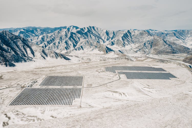 Aerial View Of Snow Covered Mountains