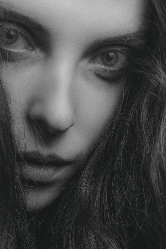 Defined brows in a dramatic close-up portrait