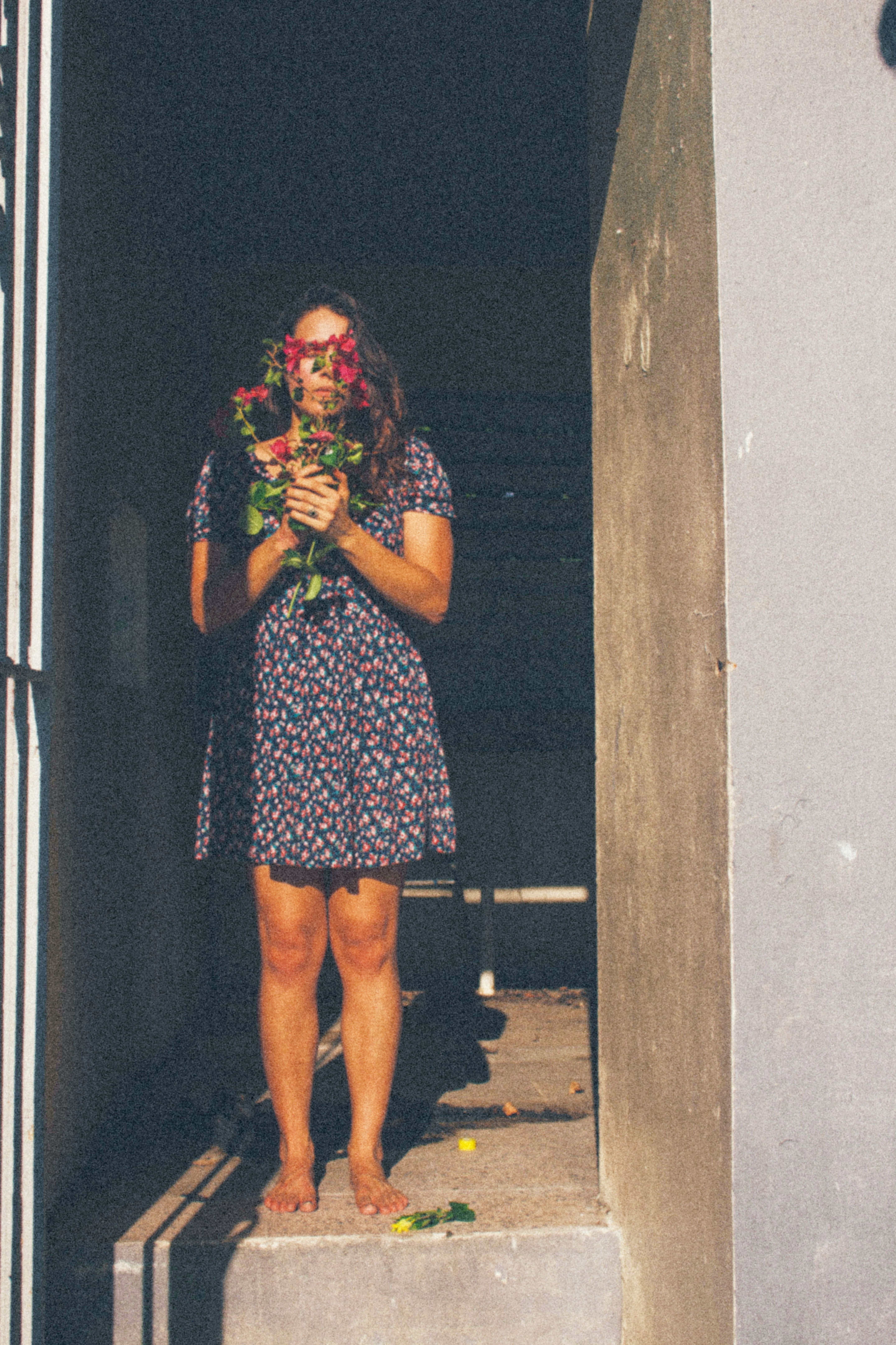 A Woman Holding Bouquet of Flowers · Free Stock Photo