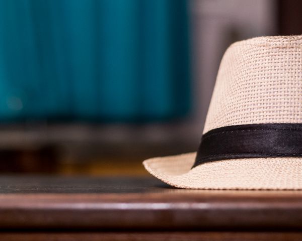 Man wearing classic fedora hat fashion portrait