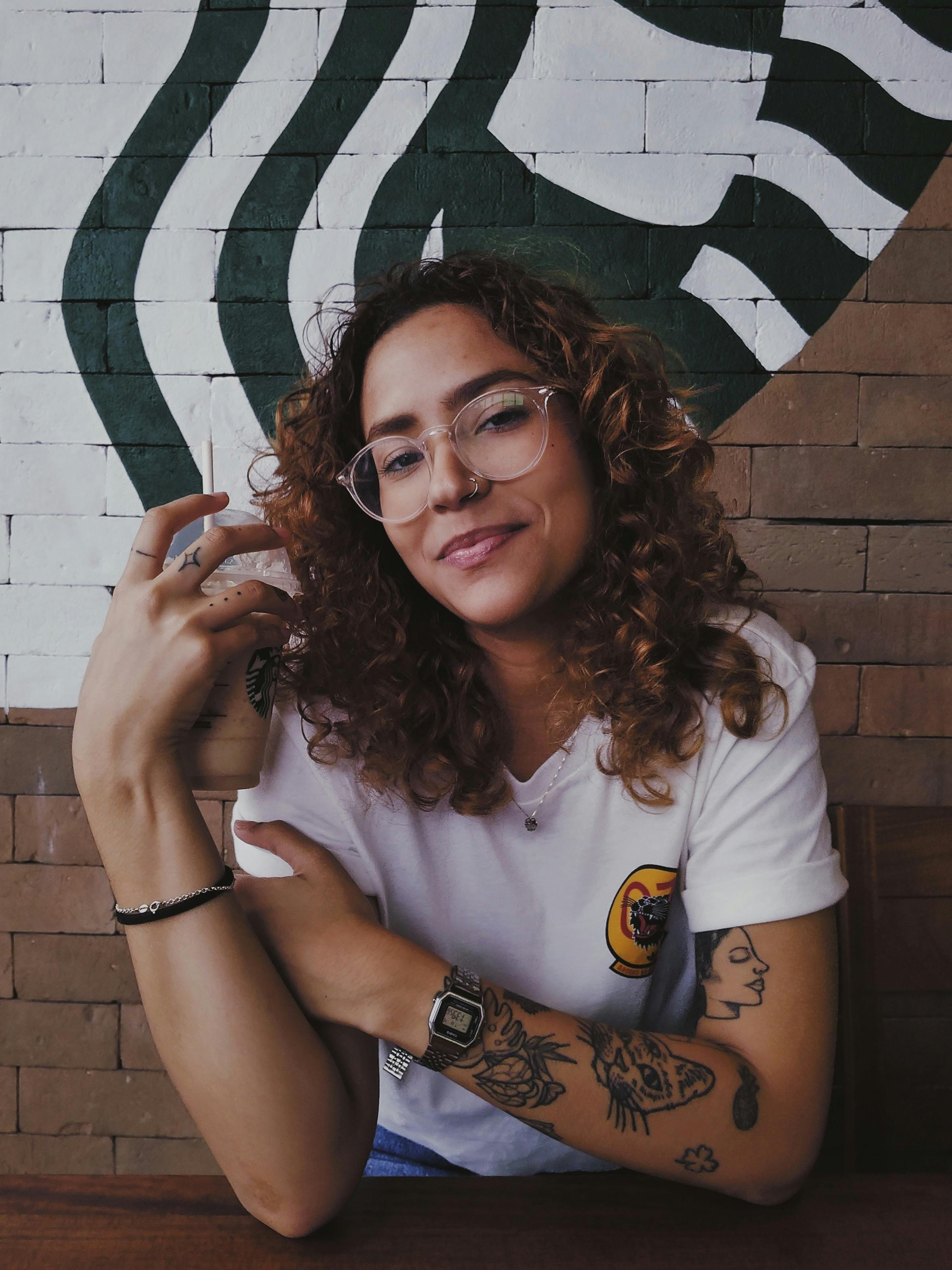 Close-up of a newborn baby’s hand holding an adult’s finger