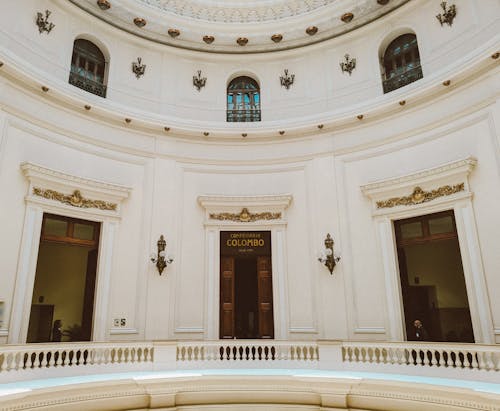 Low angle fragment of interior of historical building with white stone walls and arched windows in colonial style in Rio de Janeiro in Brazil