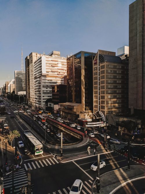 Free From above of contemporary metropolitan district with multistory buildings and asphalt road with intersections and traffic Stock Photo