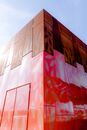 Exterior of building of contemporary art museum under blue sky
