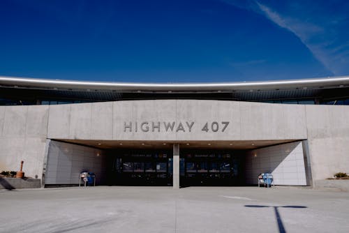 Exterior of contemporary building of Highway 407 subway station against cloudless blue sky in Toronto