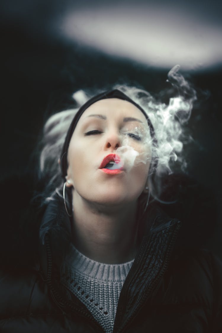 A Woman Blowing Smoke