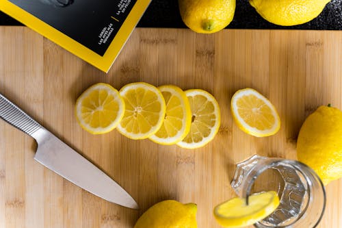 Sliced lemons for fresh drink on table